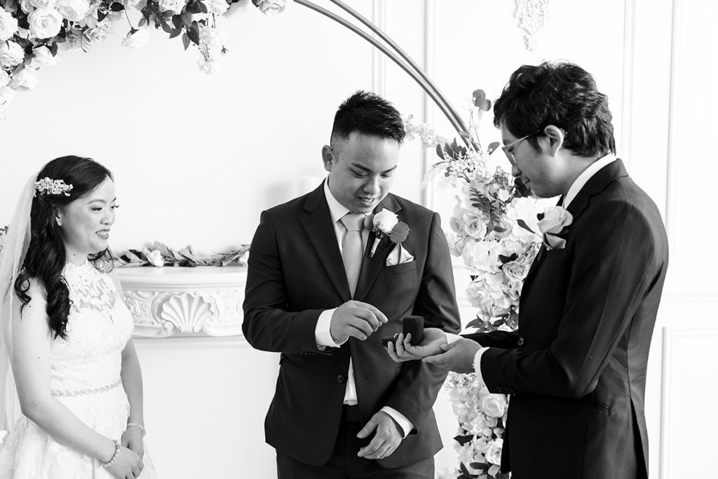 A look of awe washes over Jason's face as he picks up the wedding ring, realizing this is the moment he’s about to marry the love of his life