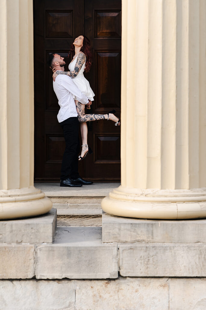 Couple standing on the steps at Dundurn Castle, soft evening light—classic architectural portrait.